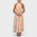 Women's halter neck maxi dress with backless design and print