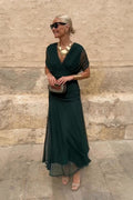 Women's maxi dress with V-neckline and floor-length skirt