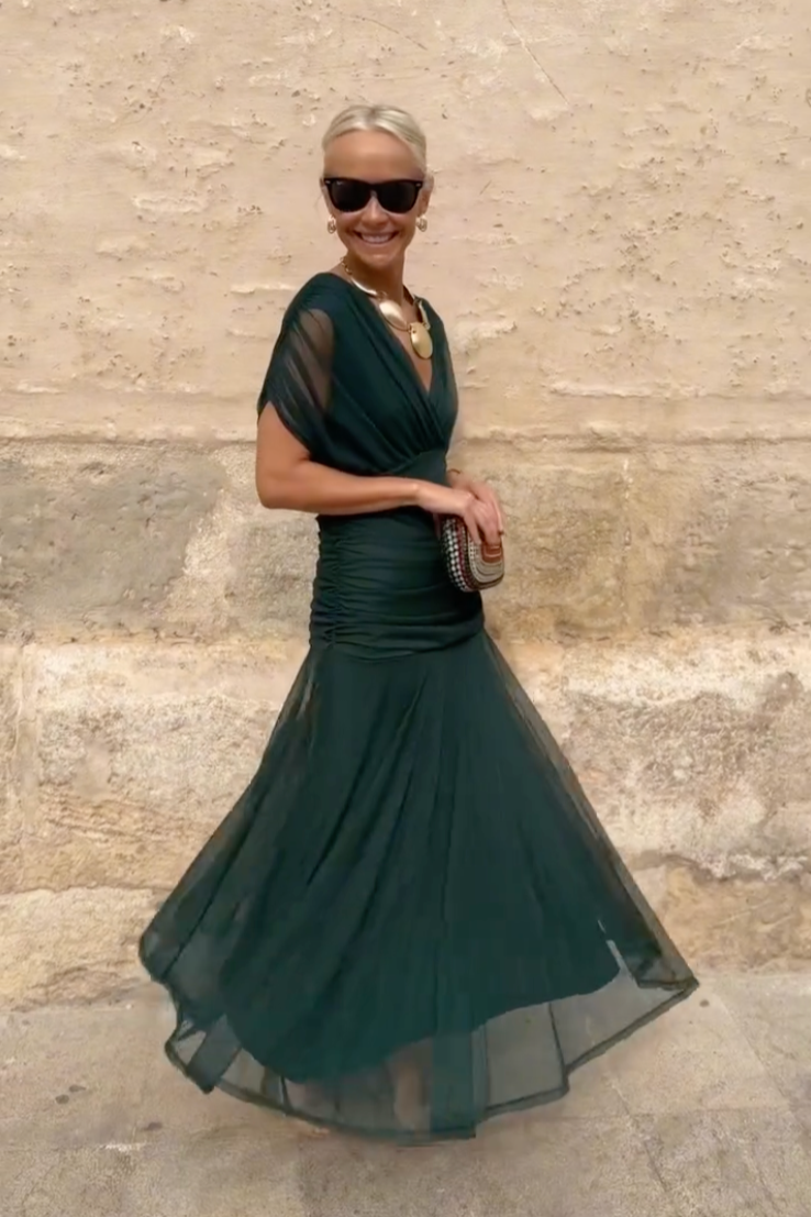 Women's maxi dress with V-neckline and floor-length skirt