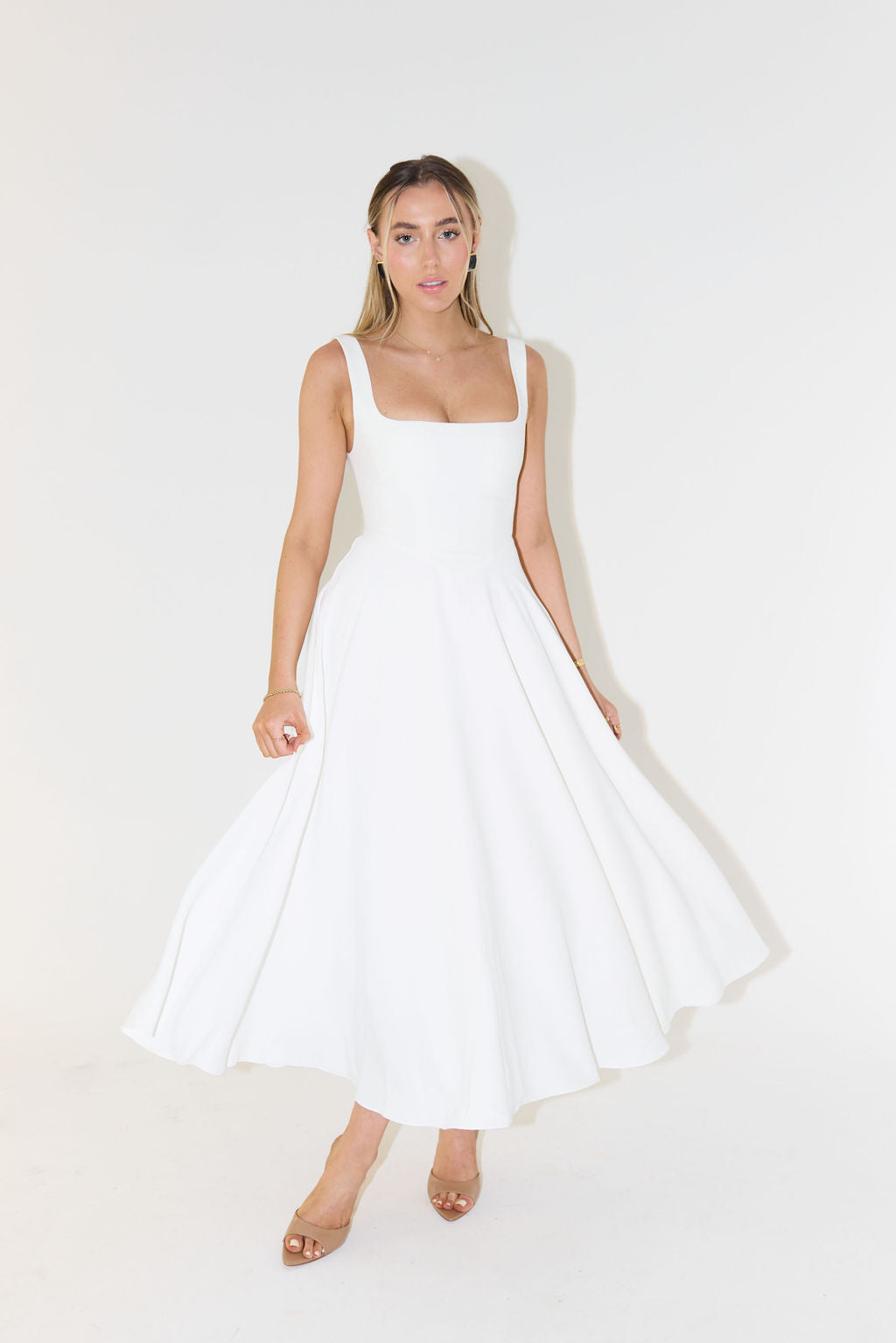 Women's midi dress with cinched waist and flowing skirt