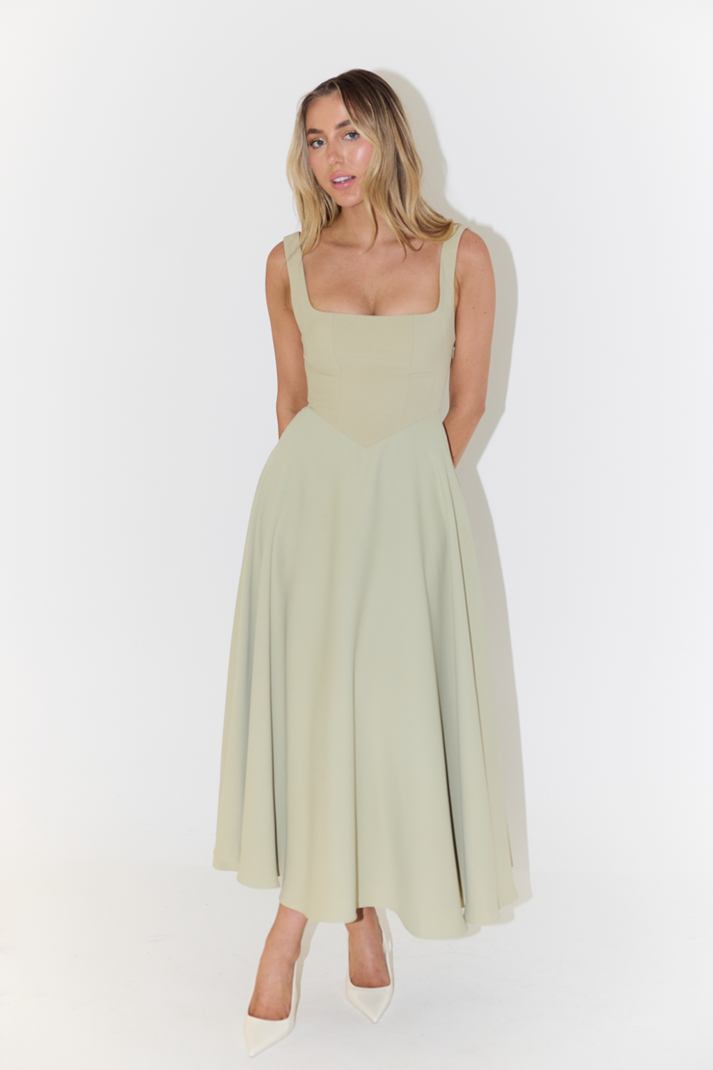 Women's midi dress with cinched waist and flowing skirt