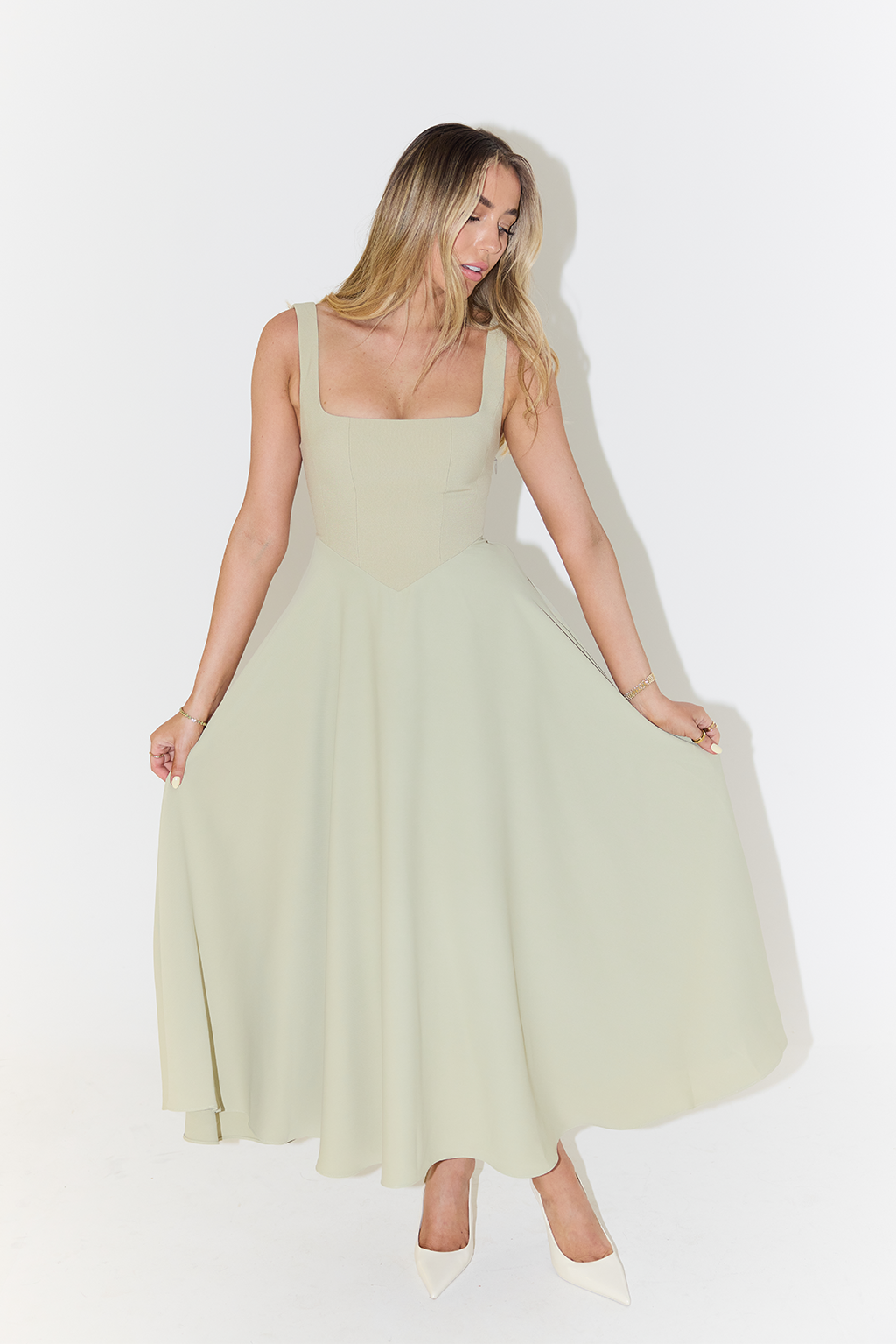 Women's midi dress with cinched waist and flowing skirt