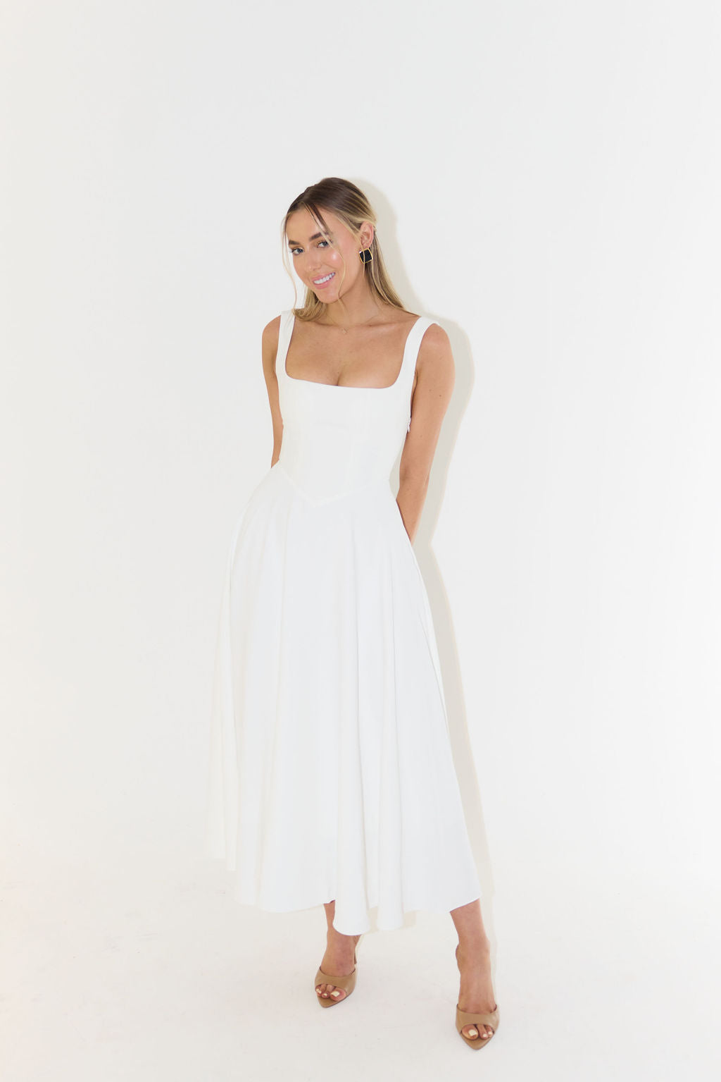 Women's midi dress with cinched waist and flowing skirt
