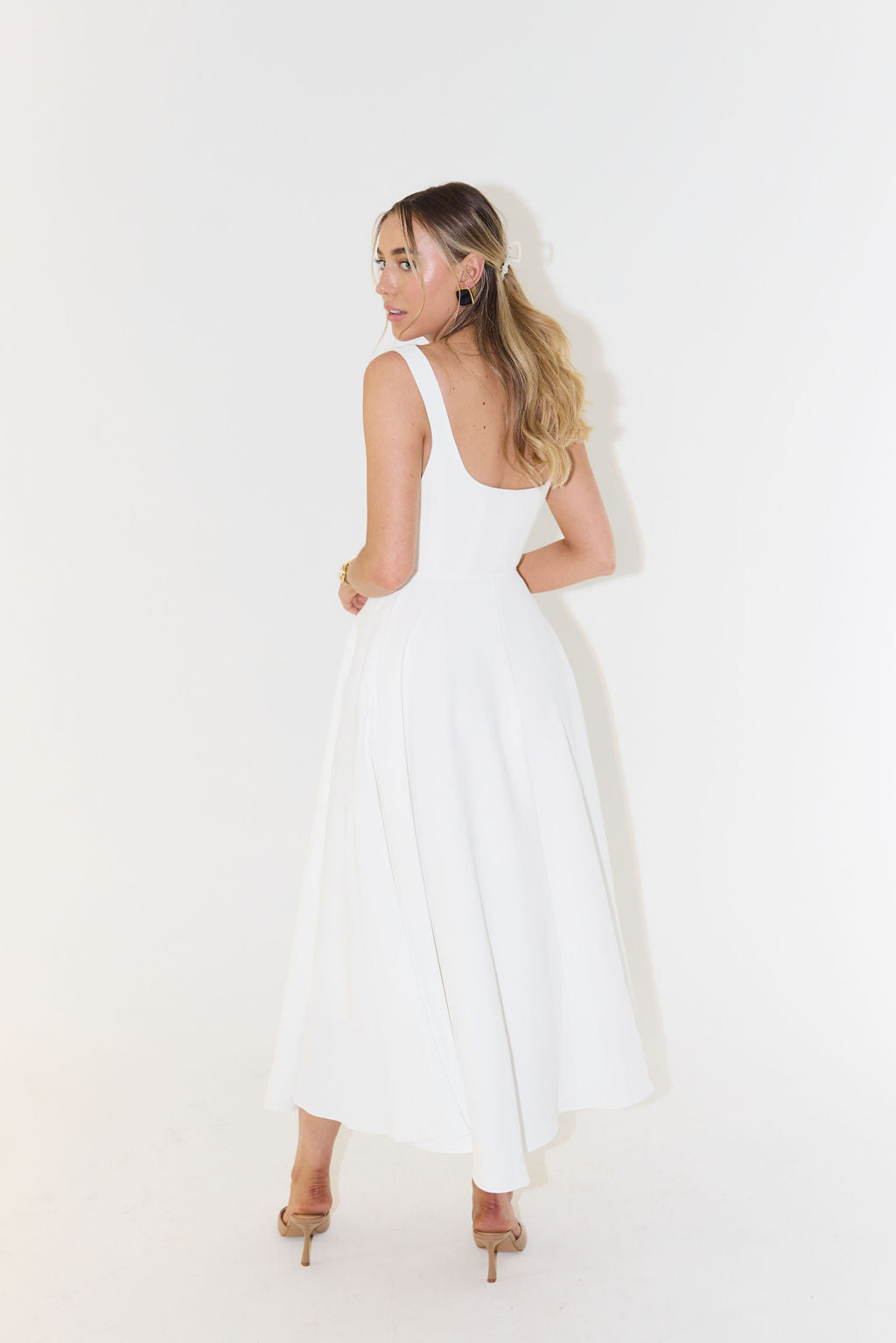 Women's midi dress with cinched waist and flowing skirt