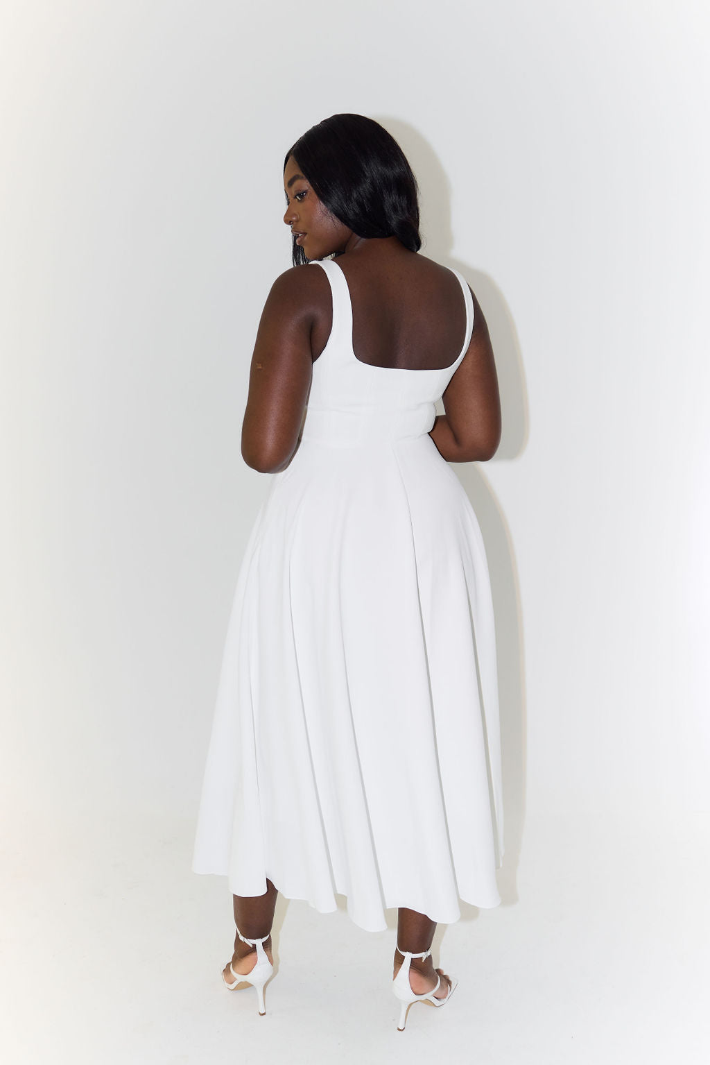 Women's midi dress with cinched waist and flowing skirt