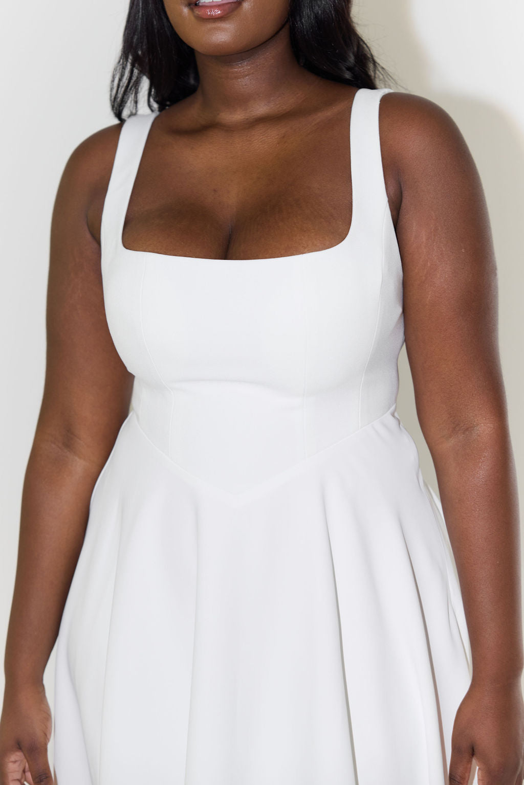 Women's midi dress with cinched waist and flowing skirt