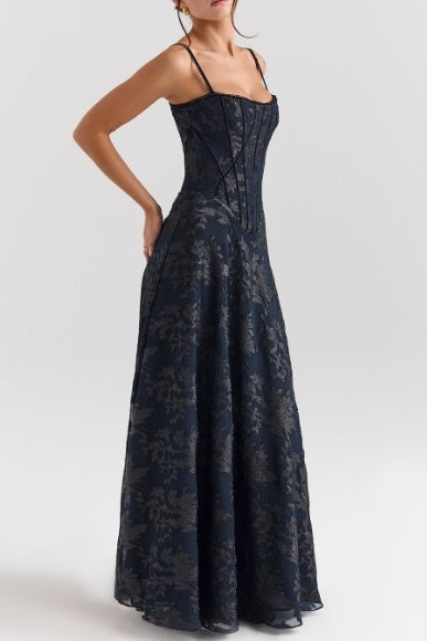 Women's spaghetti strap dress with floral print and flowing skirt