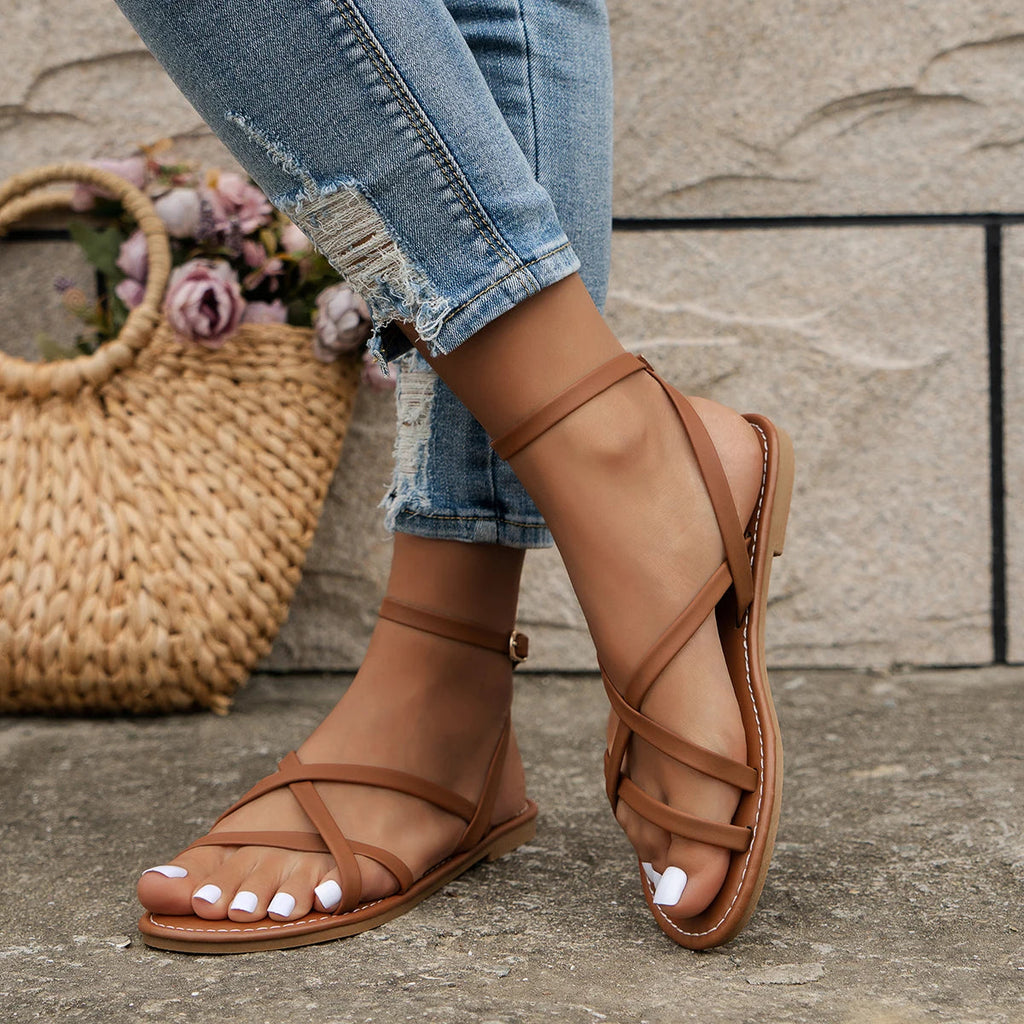Women's strappy flat sandals with Roman-style strap construction